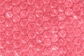 Abstract textured packaging air-bubble film background for wrapping. Background for design in pink color. Royalty Free Stock Photo