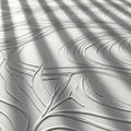 Abstract textured surface with flowing lines and dramatic shadows creating a sense of depth and movement Royalty Free Stock Photo