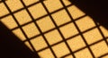 Abstract textured surface with geometric shadows creating a grid pattern Royalty Free Stock Photo