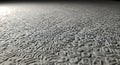 Abstract textured surface with intricate raised patterns and soft, diffused lighting creating a subtle interplay of light and Royalty Free Stock Photo