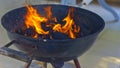 BBQ grills flame that form three dancers dancing in a black circle