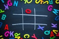 Abstract Tic Tac Toe Game Competition. XO Win Challecge Concept on black board Royalty Free Stock Photo