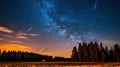 Abstract time lapse night sky with shooting stars over forest landscape. Milky way glowing lights background Royalty Free Stock Photo