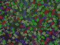 Abstract tiny green red blue flowers shapes pattern on messy green background, natural floral, nature garden pattern Royalty Free Stock Photo