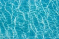 Abstract top view blue ripple swimming pool water and sun reflection caustics