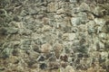 Abstract traditional stone wall pavement texture background. Bumpy textured stonewall made from flagstone and slabstone Royalty Free Stock Photo