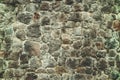 Abstract traditional stone wall pavement texture background. Bumpy textured stonewall made from flagstone and slabstone Royalty Free Stock Photo