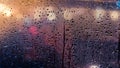 Rain drops on window Abstract traffic in raining day. View from car seat Royalty Free Stock Photo