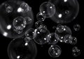 Abstract Transparent Soap Bubbles Floating on Black Background.