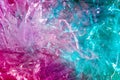 Holographic background in the style of the 80-90s. Real texture of cellophane film in bright acid colors. Royalty Free Stock Photo