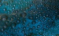 Abstract turquoise-malachite background of drops and droplets. Close up.