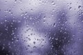 Abstract ultra violet background, texture of rain drops on glass