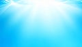 Abstract Underwater Scene with Sunbeams in Bright Blue Water Background Royalty Free Stock Photo