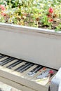 Abstract upright pianos in wood with flowers. Vertical