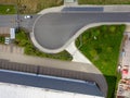 Abstract vertical aerial view of a turning loop in front of the barrier with access to a company premises