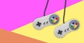 Abstract video gaming controller: Vintage gamepad on colorful background