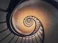 Abstract view of a circular staircase with black metal railing, inside the triumphal arch, Paris, France. Abstract background, a Royalty Free Stock Photo