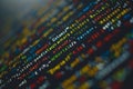Abstract view of colorful programming language elements with blurred lights.
