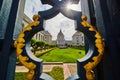 Abstract view of courtyard and city hall through fancy black and golden gilded lamppost