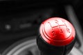 Abstract view of a gear lever, manual gearbox, car interior details. Black and white, red. Royalty Free Stock Photo