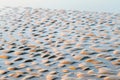 Abstract view of natural sand dune formation at the beach. Curly sand wave pattern closeup. Beautiful sandy background. Nobody Royalty Free Stock Photo