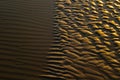 Abstract view of natural sand dune formation at the beach. Curly sand wave pattern closeup. Beautiful sandy background. Nobody Royalty Free Stock Photo