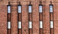 Abstract view of an old brick building with elongated rectangular windows