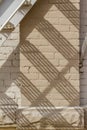 Abstract view of an old gray fire escape staircase in front of a vintage brick wall Royalty Free Stock Photo