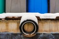 Abstract View of an Old Tire Hanging from a Fishing Boat After a Dusting of Snow.