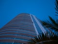 Abstract view on residential apartment complex building with many balconies and floors isolated against blue sky on sunny day Royalty Free Stock Photo