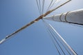 Abstract view of sailing boat mast with rigging Royalty Free Stock Photo