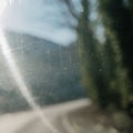 Abstract View Through a Scratched Windshield with Sunlight