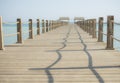 View along large wooden jetty on tropical island