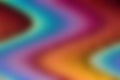 Abstract view of smooth blurry curls of rainbow color