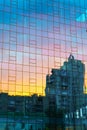 Abstract view of sunset sky reflection in modern business glass wall building Royalty Free Stock Photo