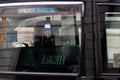 An abstract view through a taxi window to a bank terminal for payment for a London taxi ride , London, UK