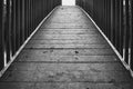 Abstract view of a timber-built footbridge showing detail of the design and construction.