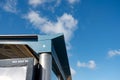 Abstract view of the top of a newly installed metal bus shelter.