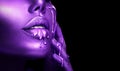 Abstract Violet makeup, Lipstick dripping. Purple Paint drops on sexy lips. Lipgloss drops, Liquid drops on beautiful face Royalty Free Stock Photo