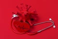 Abstract Virus Strain Model And Stethoscope On red Background. C