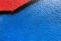 Abstract wall surface with part of graffiti. Geometric lines, light blue, black, red colors background Royalty Free Stock Photo