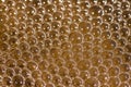 Abstract water bubbles on dirty orange colored  water close up macro shot Royalty Free Stock Photo