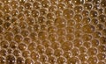 Abstract water bubbles on dirty orange colored  water close up macro shot Royalty Free Stock Photo