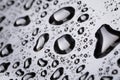 Abstract water drops on polished stainless steel surface Royalty Free Stock Photo