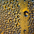 Abstract water drops on yellow background texture. backdrop glass covered with drops of water. bubbles in water. Royalty Free Stock Photo
