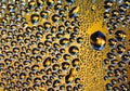 Abstract water drops on yellow background texture. backdrop glass covered with drops of water. bubbles in water. Royalty Free Stock Photo