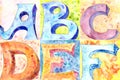 Abstract watercolor alphabet. letters A, B, C,D,E,F. blue and red on a blurred yellow and green background Royalty Free Stock Photo