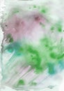 Abstract watercolor pattern. Green, turquoise, lilac spots and streaks on a gray background. Royalty Free Stock Photo