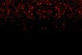 Abstract waterfalls of red glitter sparkle bubbles particles bokeh on black background,christmas and happy new year holiday Royalty Free Stock Photo