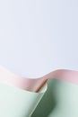 Abstract wave of pastel green and pink paper on light blue background. Creative geometric curved paper with light and Royalty Free Stock Photo
